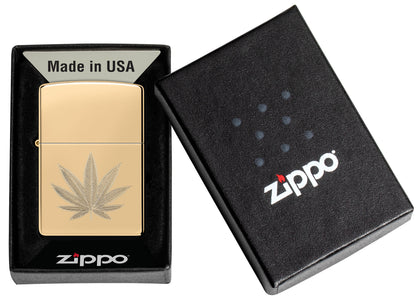 Zippo Cannabis Leaf Design High Polish Brass Windproof Lighter in its packaging.