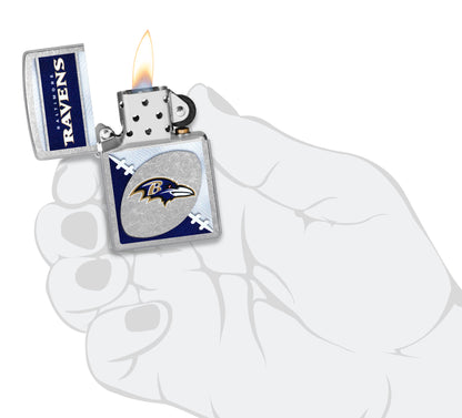 Zippo NFL Baltimore Ravens Street Chrome Windproof Lighter lit in hand.