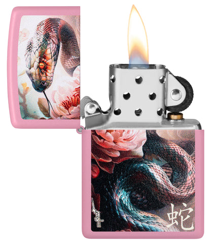 Zippo Mazzi® Snake and Flower Design Pink Matte Windproof Lighter with its lid open and lit.