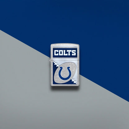 Lifestyle image of Zippo NFL Indianapolis Colts Street Chrome Windproof Lighter set on a blue and gray background.