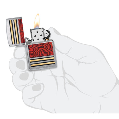 Zippo Woodgrain Design Brushed Chrome Windproof Lighter lit in hand.