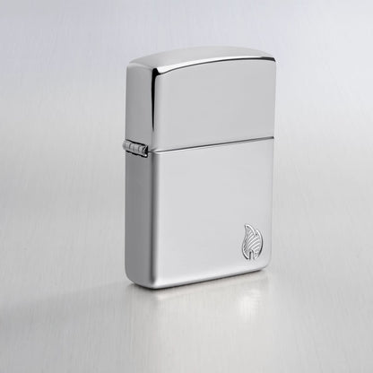 Lifestyle image of Zippo Armor® Series Flame High Polish Chrome Windproof Lighter on a light gray background.