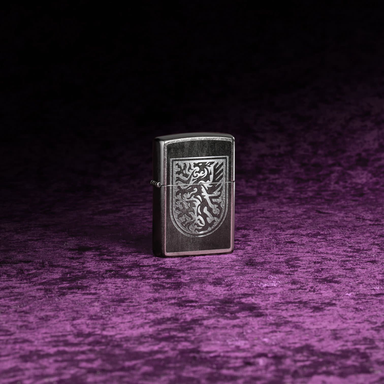 Lifestyle image of Zippo Dragon Shield Design Street Chrome Windproof Lighter.