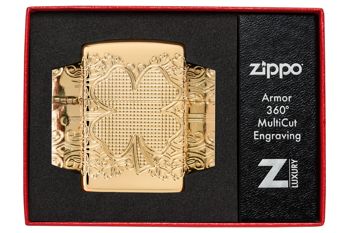 Zippo Lucky Clover Design Armor® High Polish Gold Plate Windproof Lighter in its packaging.