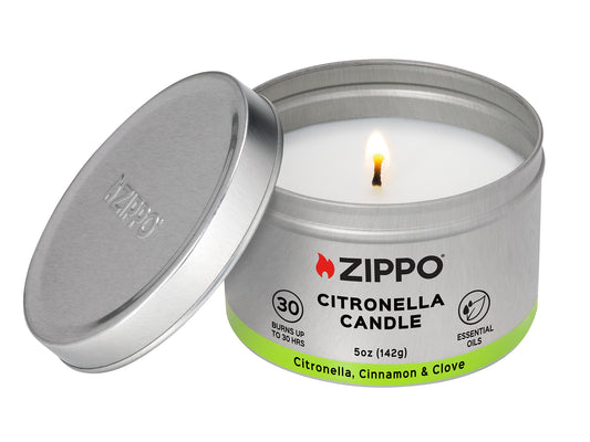 Front view of Zippo Citronella Candle - Cinnamon and Clove lit with the lid leaning against the candle.

