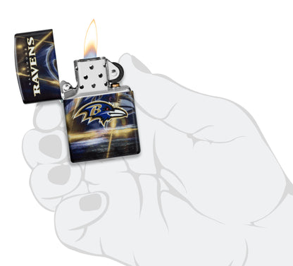 Zippo NFL Baltimore Ravens 540 Matte Windproof Lighter lit in hand.