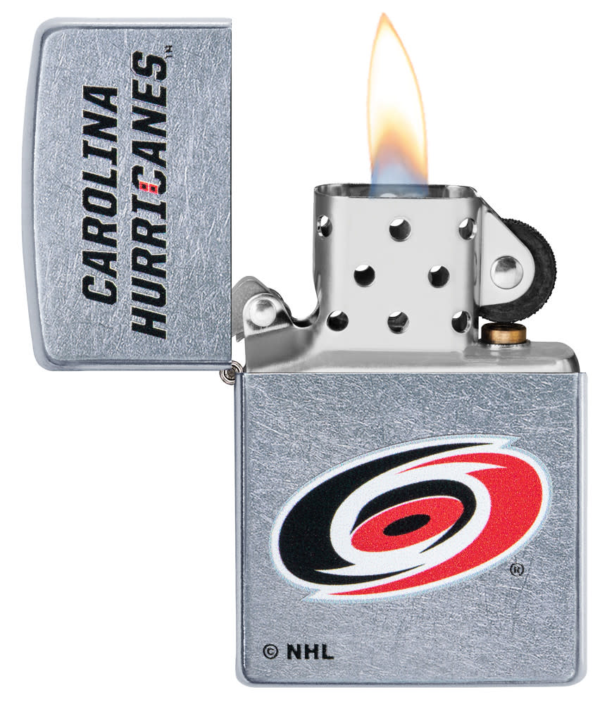 NHL Carolina Hurricanes Street Chrome™ Windproof Lighter with its lid open and lit