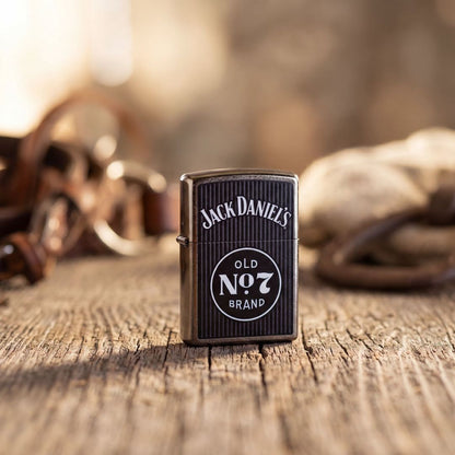 Lifestyle image of Zippo Jack Daniel's Old No. 7 Pinstripe Design Street Chrome Windproof Lighter standing on a wooden table showing the front of the lighter with an out of focus background. 

