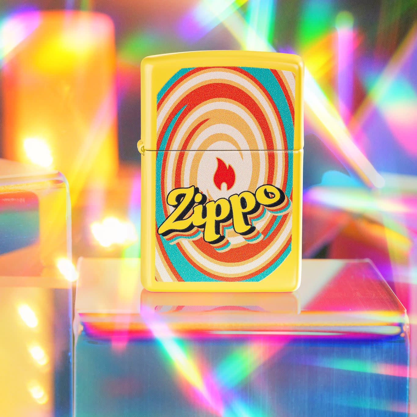 Lifestyle image of Zippo Swirls Design Sunflower Windproof Lighter standing on a cube with prism lights surrounding it.