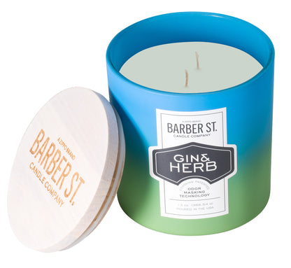 Front shot of Zippo Barber Street Gin Herb  Odor Masking Candle, with its lid off