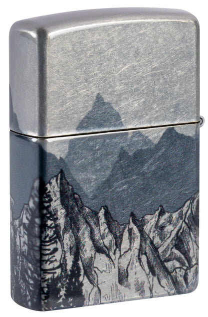 Back shot of Zippo Mountain Sketch Design 540 Tumbled Chrome Windproof Lighter standing at a 3/4 angle.