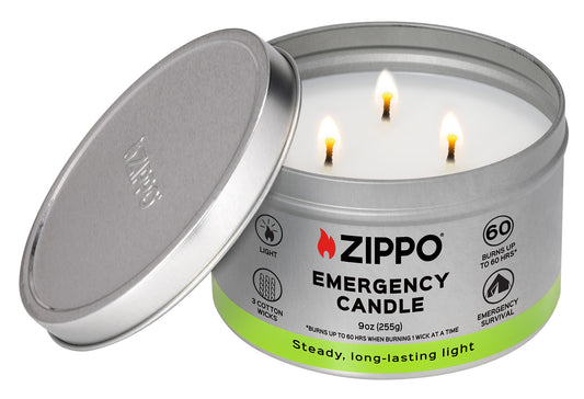 Front view of Zippo Emergency Candle lit with the lid leaning against the candle. 
