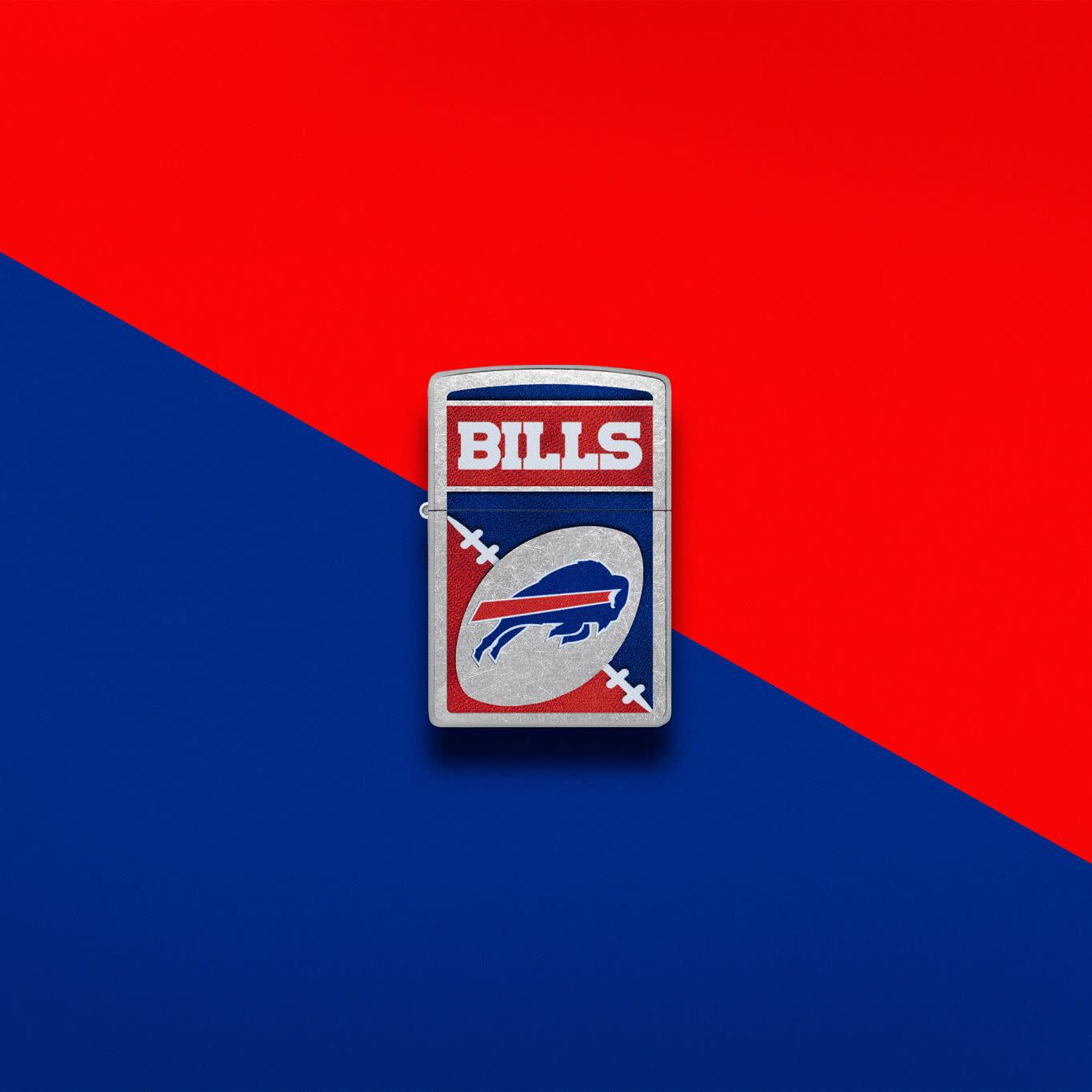 Lifestyle image of Zippo NFL Buffalo Bills Street Chrome Windproof Lighter set on a blue and red background.