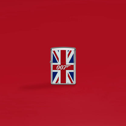 Lifestyle image of Zippo James Bond Union Jack Design Brushed Chrome Windproof Lighter standing with a red background.

