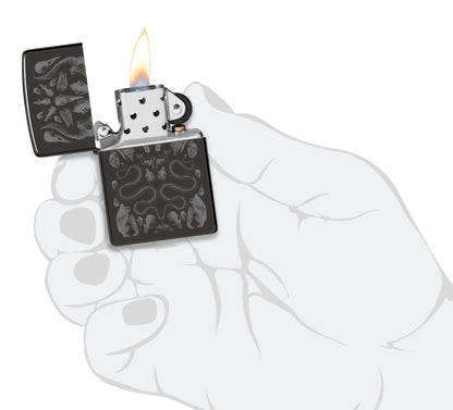 Zippo Bone Mosaic Design Ebony Windproof Lighter lit in hand.
