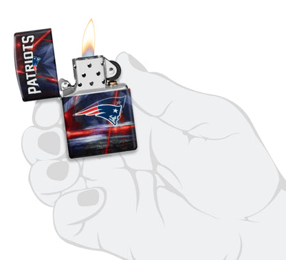 Zippo NFL New England Patriots 540 Matte Windproof Lighter lit in hand.