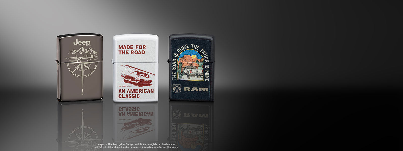 Three automotive theme lighters on a reflective surface with a dark background