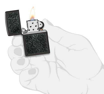 Zippo Pattern Design High Polish Black Windproof Lighter lit in hand.