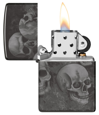 Zippo Skulls High Polish Black Windproof Lighter with its lid open and lit.