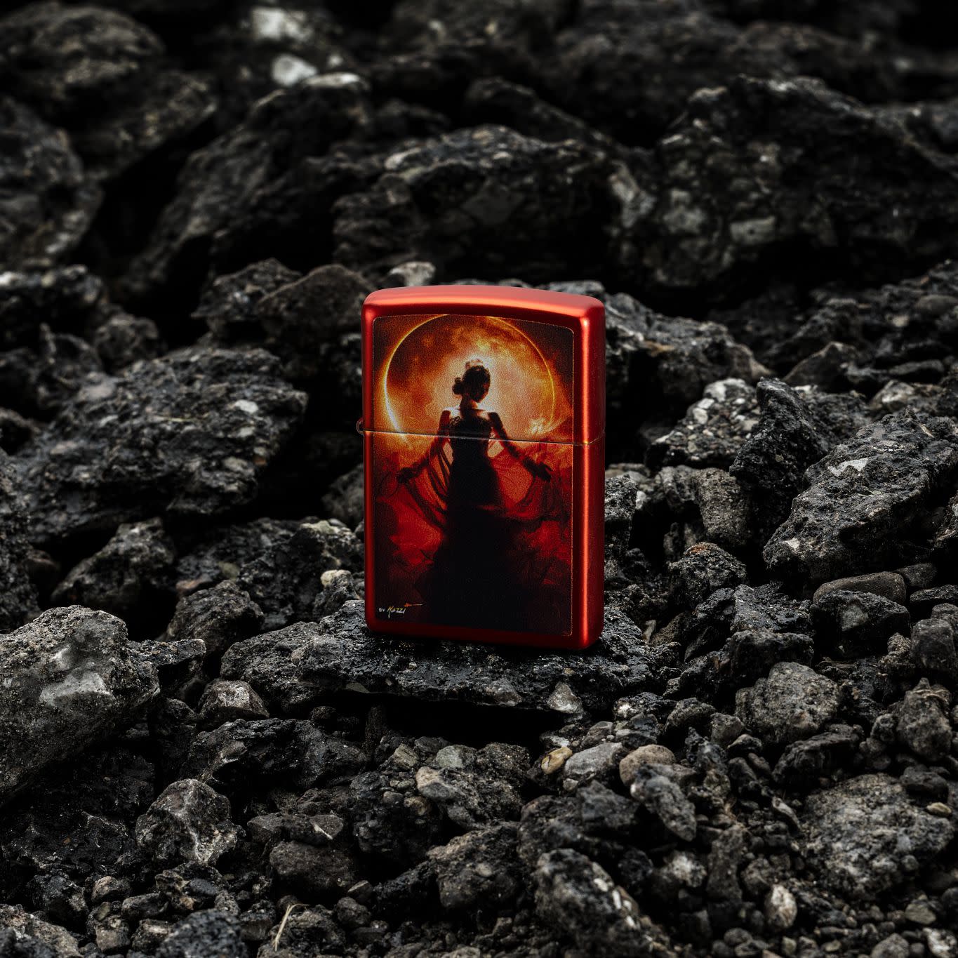 Lifestyle image of Zippo Mazzi® Woman Silhouette Metallic Red Windproof Lighter standing on crumbled blacktop.