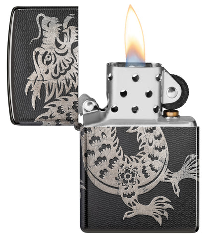 Zippo Lucky Dragon Design High Polish Black Windproof Lighter with its lid open and lit.