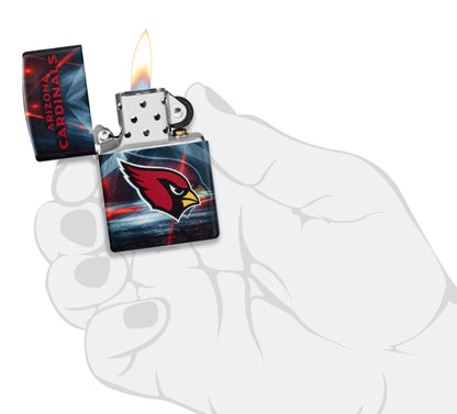 Zippo NFL Arizona Cardinals 540 Matte Windproof Lighter lit in hand.