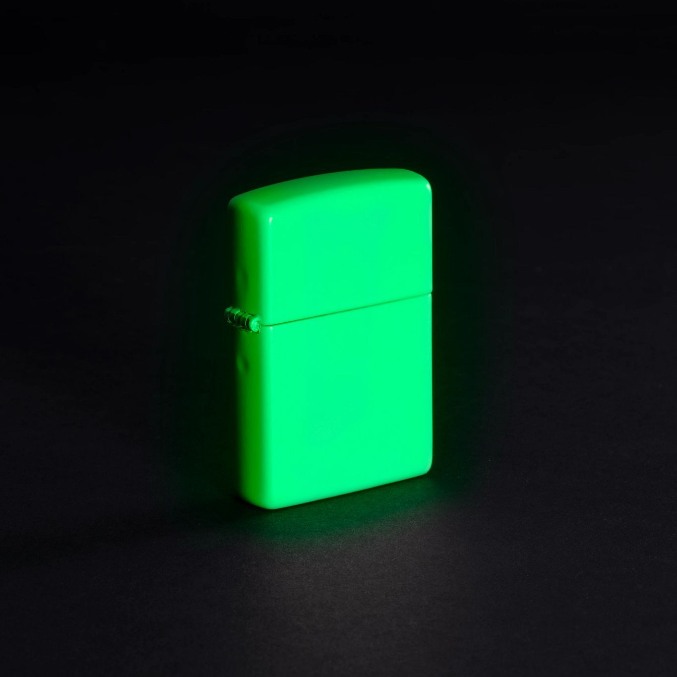 Lifestyle image of Classic Glow In The Dark Windproof Lighter, glowing in the dark