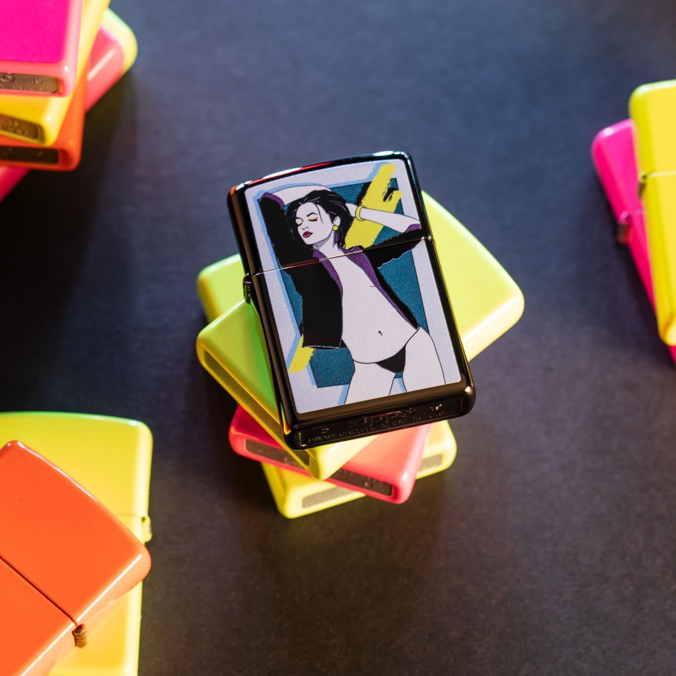 Front view of the Pop Art Women Design Lighter shot on a stack on multcolored neon lighters 