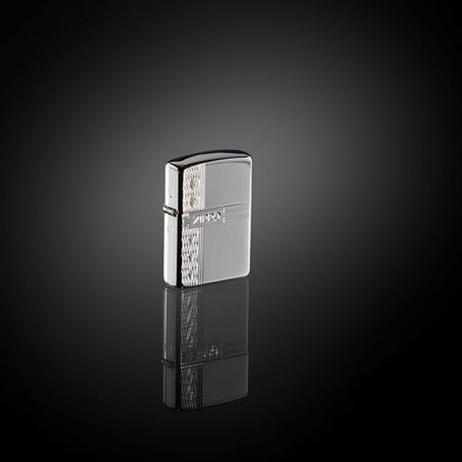 Lifestyle image of ArmorÂ® Sterling Silver Zippo Diamond Design Windproof Lighter standing in a black mirrored surface