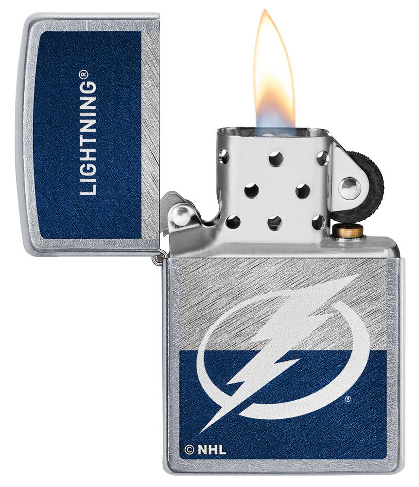 NHL® Tampa Bay Lightning Street Chrome™ Windproof Lighter with its lid open and lit