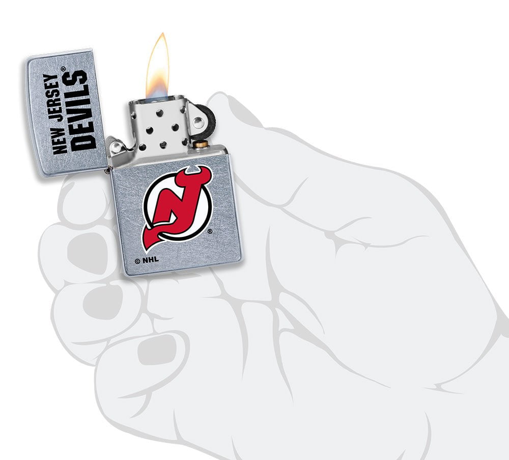 NHL New Jersey Devils Street Chrome™ Windproof Lighter lit in hand