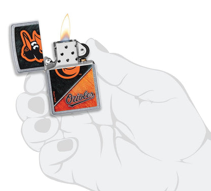 MLB® Baltimore Orioles™ Street Chrome™ Windproof Lighter lit in hand.