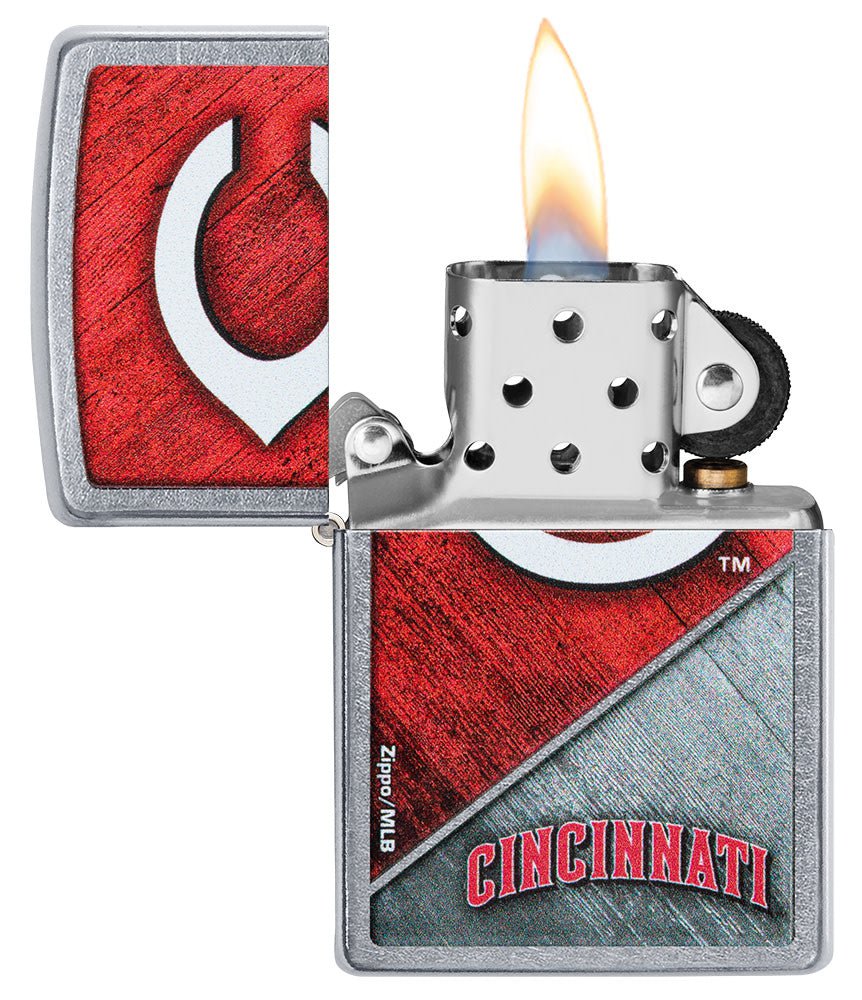 MLB® Cincinnati Reds™ Street Chrome™ Windproof Lighter with its lid open and lit.