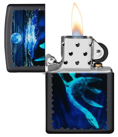 Black Light Loch Ness Design Black Matte Windproof Lighter with its lid open and lit.