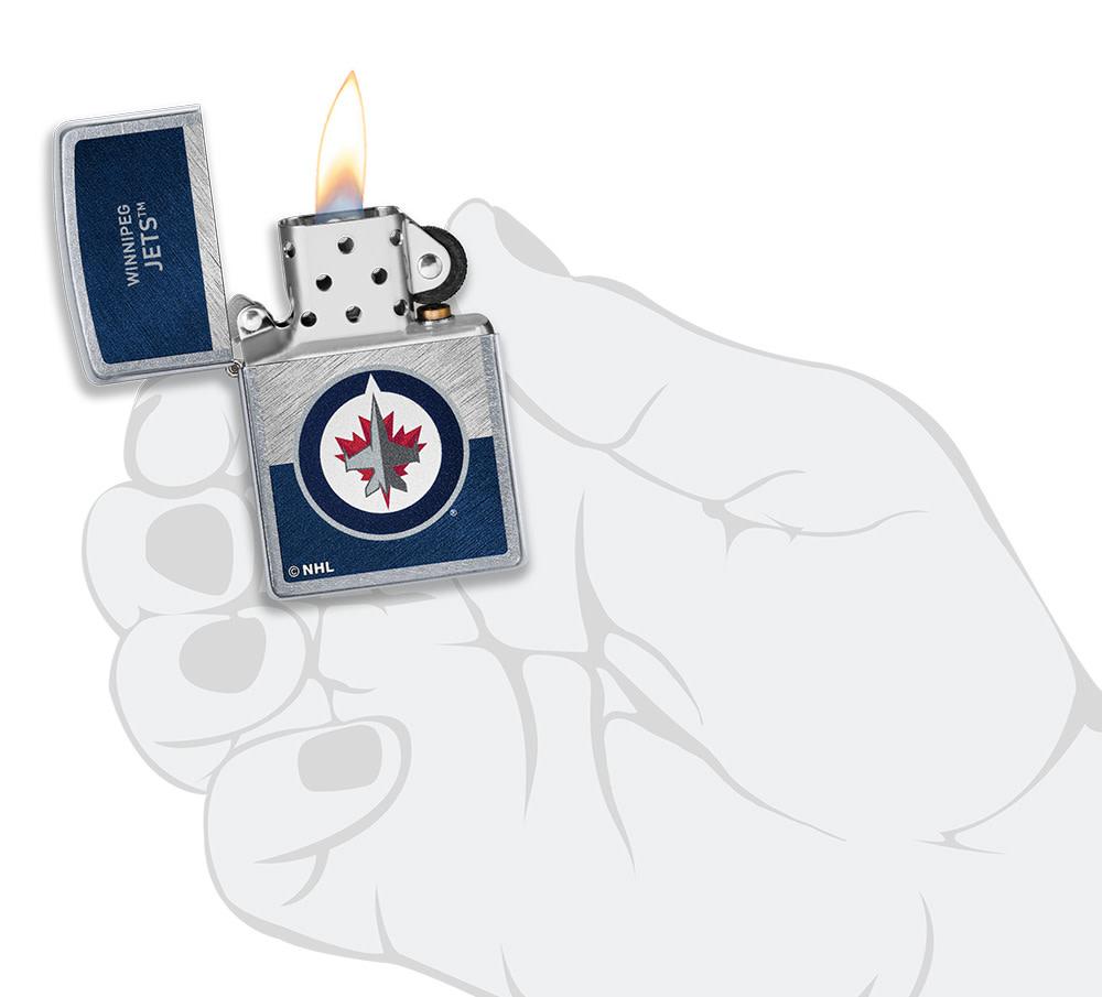 NHL® Winnipeg Jets Street Chrome™ Windproof Lighter lit in hand