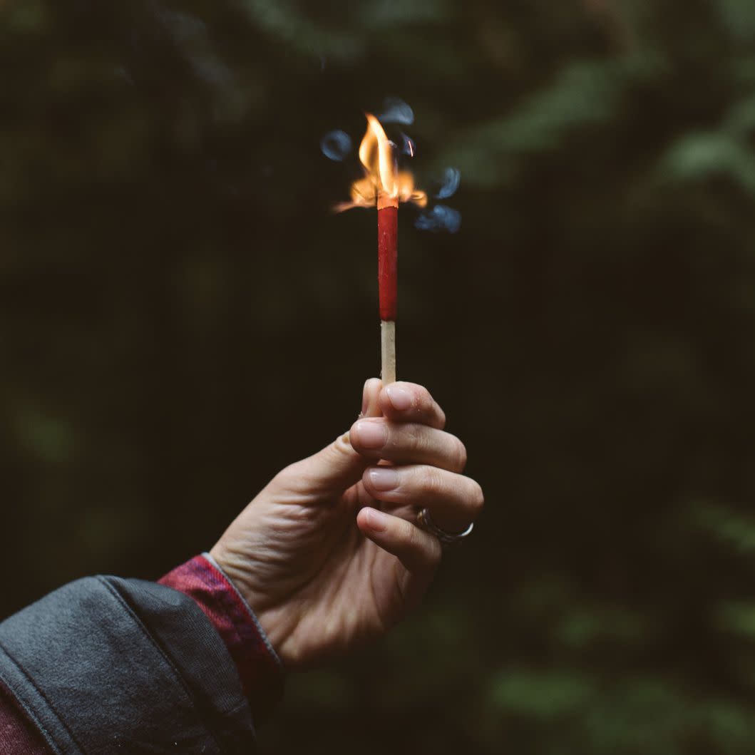 Lifestyle image of Typhoon Matches lit in hand