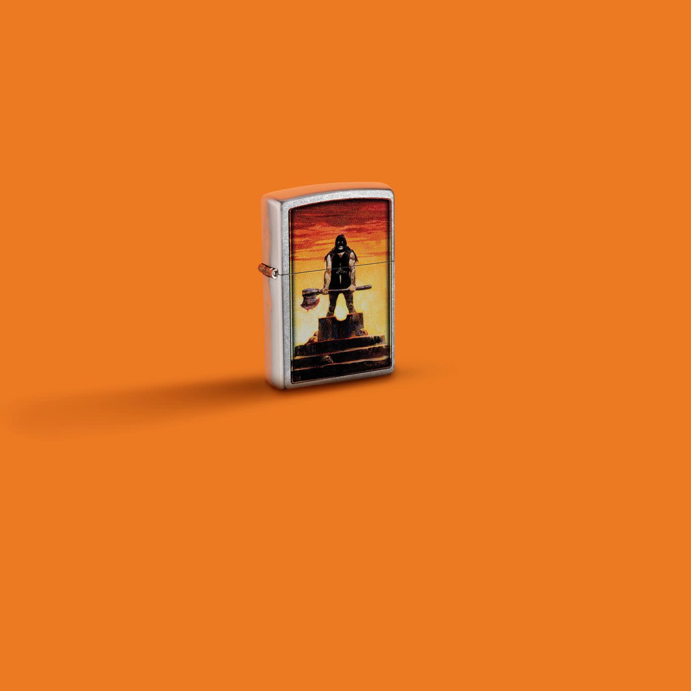 Glamour shot of Zippo Frank Frazetta Executioner Street Chrome Executioner standing in an orange scene.