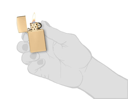 Slim® High Polish Brass Finish Windproof Lighter lit in hand.