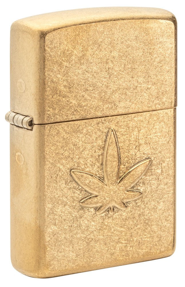 Front shot of Cannabis Design Stamped Leaf Tumbled Brass Windproof Lighter standing at a 3/4 angle.