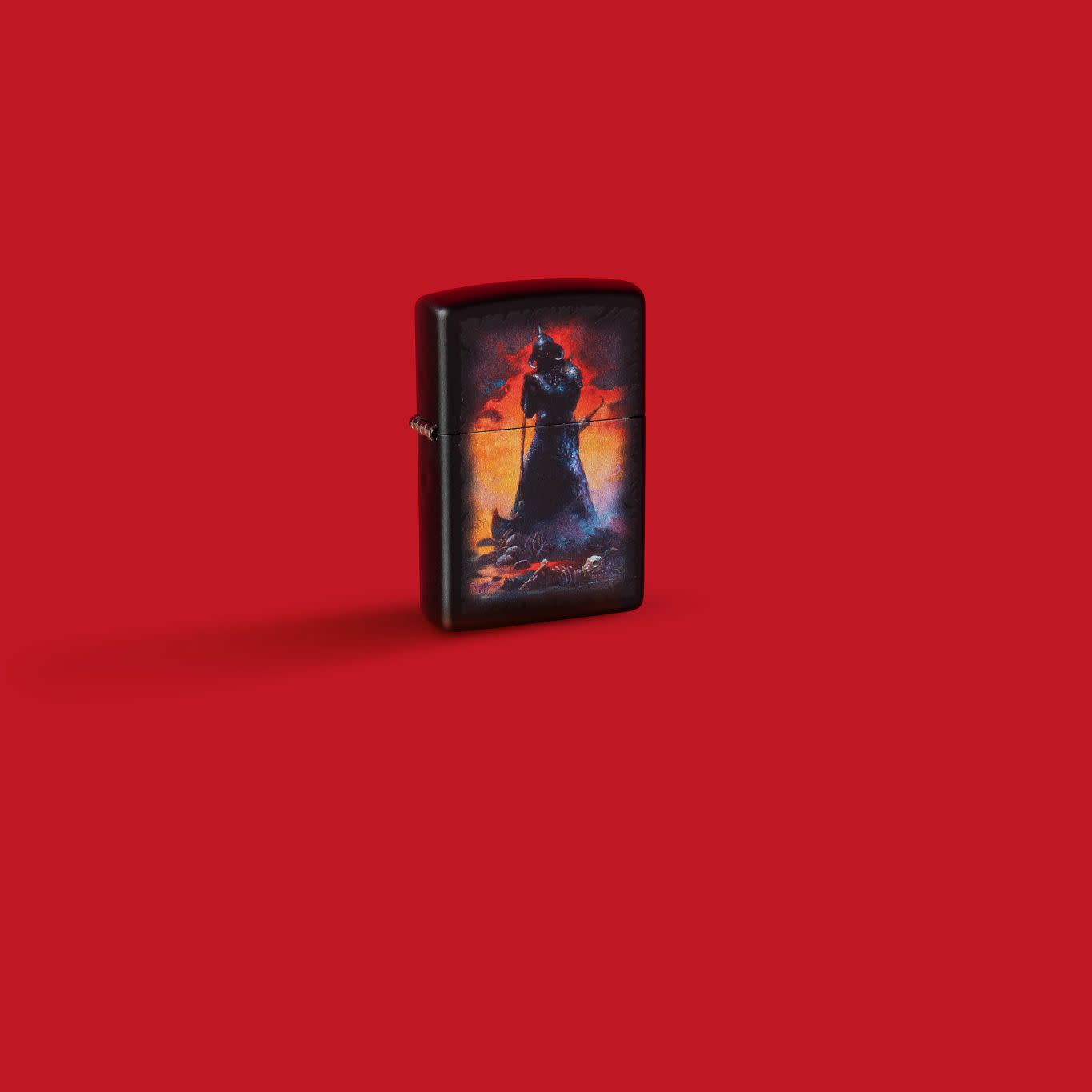 Glamour shot of Zippo Frank Frazetta Evil Overlord Black Matte Windproof Lighter standing in a red scene.